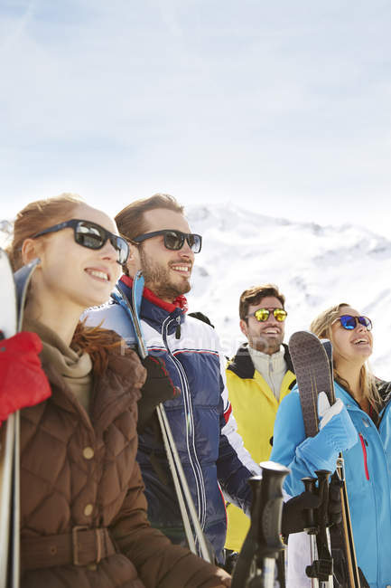 Happy caucasian friends admiring the snow together — Stock Photo