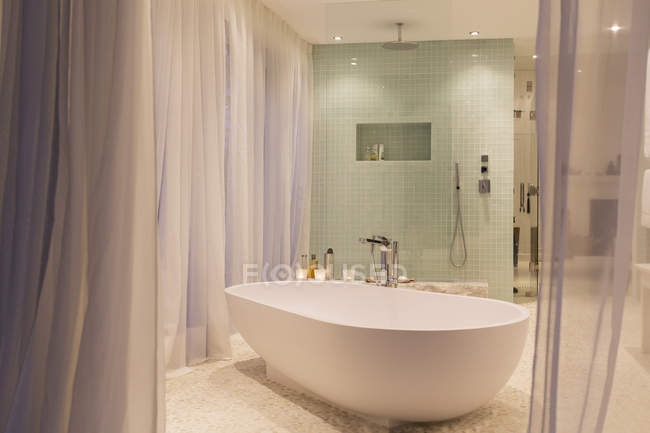 Bathtub and shower in modern bathroom — Stock Photo