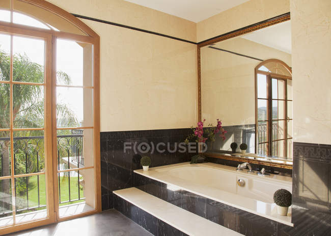 Marble bathtub in luxury bathroom — Stock Photo