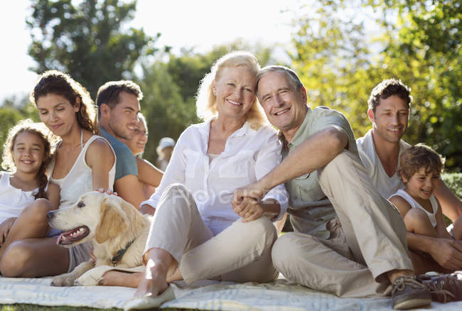 Family relaxing together in backyard — Stock Photo