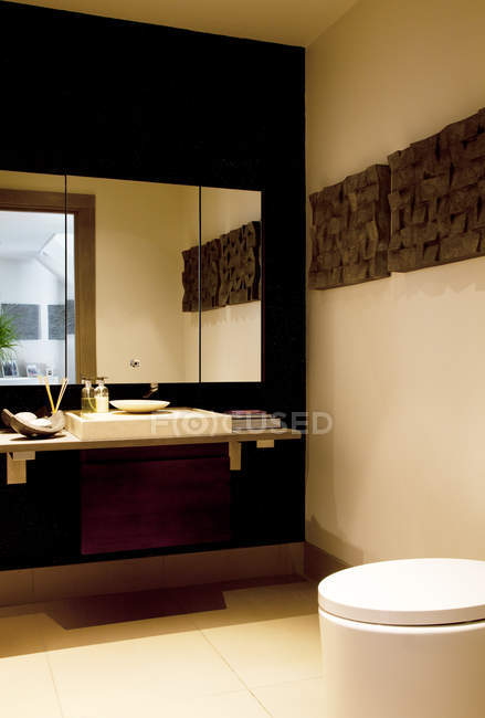 Mirror and sink in modern bathroom — Stock Photo