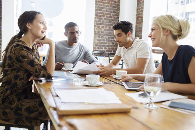 Business people talking at meeting in cafe — Stock Photo