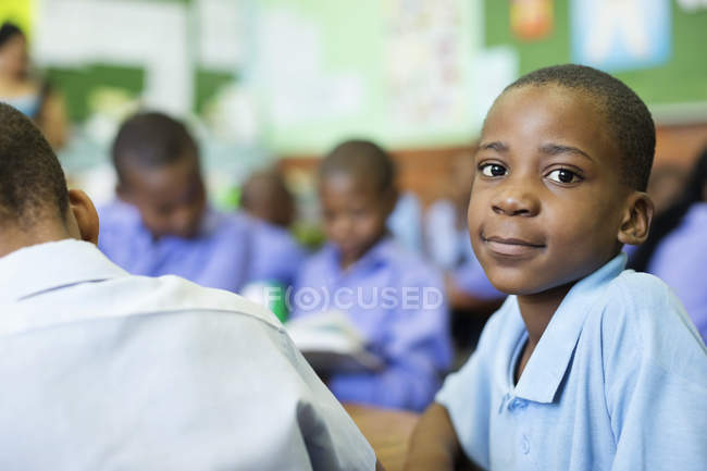 African american student smiling in class — Stock Photo