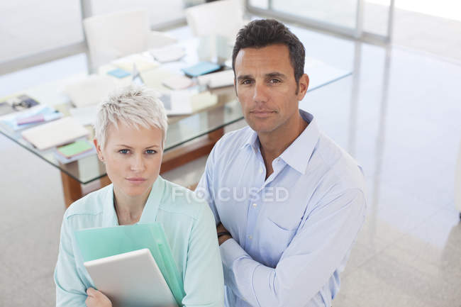Business people standing together at modern office — Stock Photo