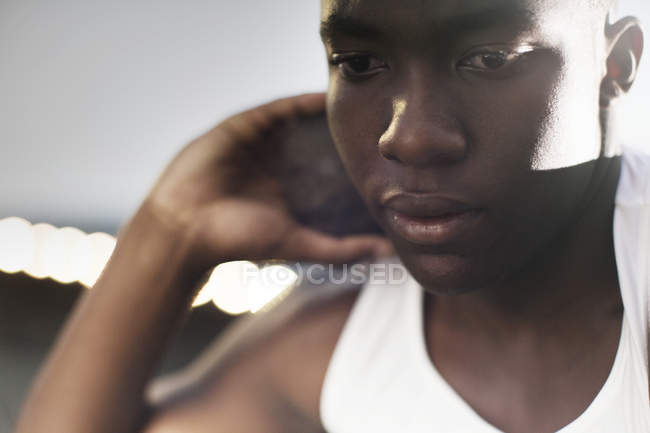Close up of track and field athlete holding shot put — Stock Photo