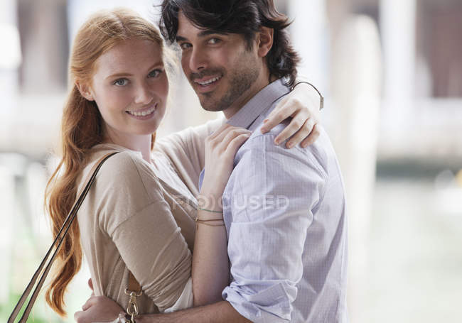 Portrait of smiling couple hugging — Stock Photo