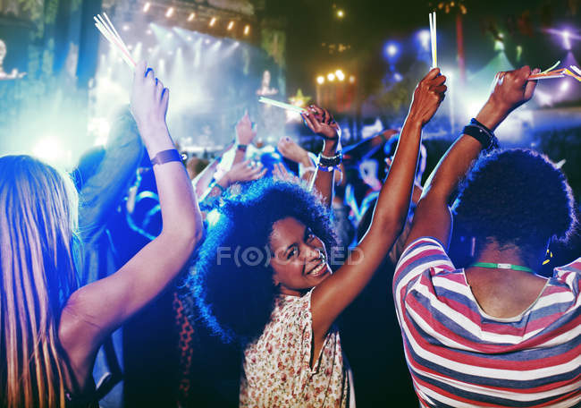Portrait of cheering woman at music festival — Stock Photo