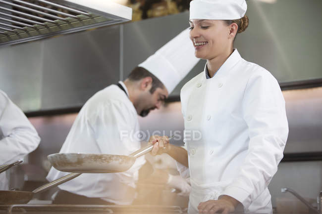 Chef cooking in restaurant kitchen — Stock Photo