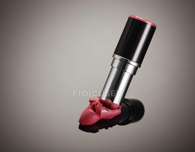 Close up of crushed tip of pink lipstick — Stock Photo