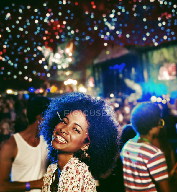 Portrait of enthusiastic woman at music festival — Stock Photo