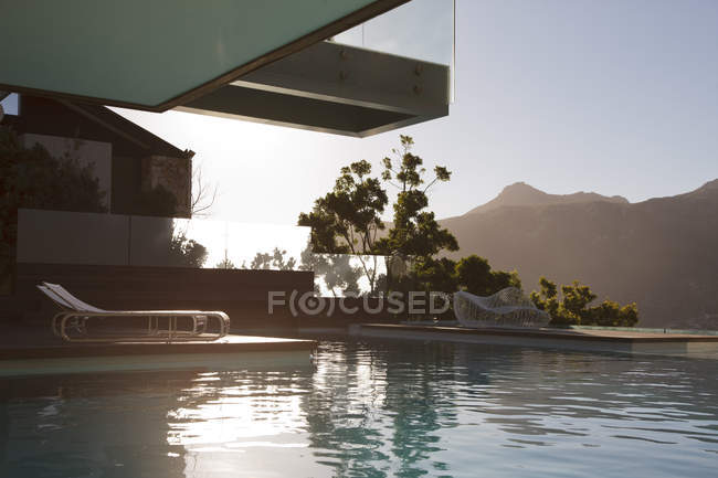 Luxury swimming pool with mountain view — Stock Photo