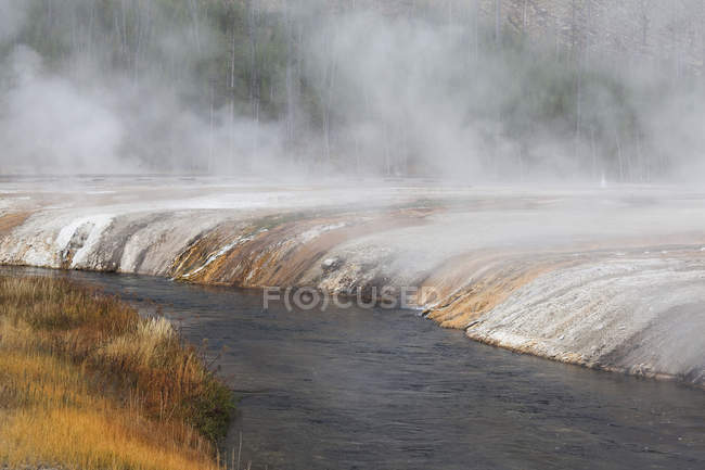 Mist over sand basin and river — Stock Photo