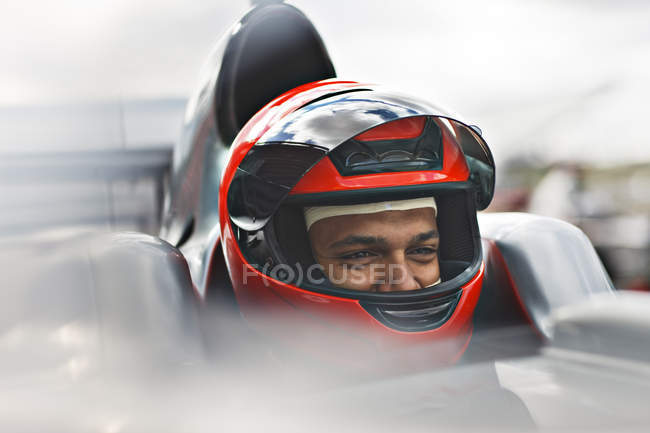 Racer sitting in car on track — Stock Photo