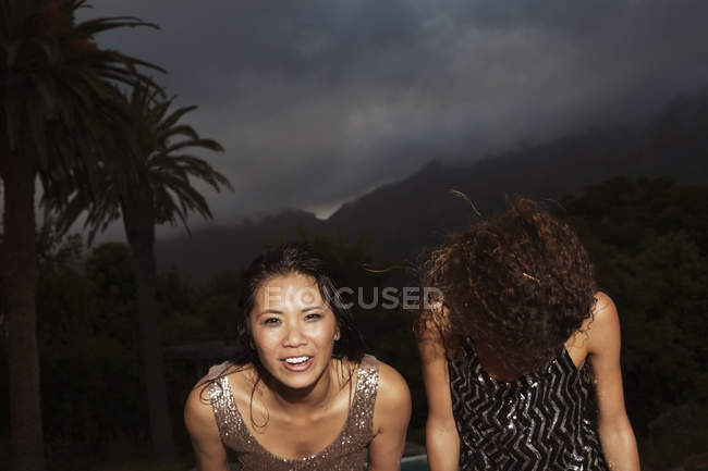 Young attractive Women standing outside in storm — Stock Photo