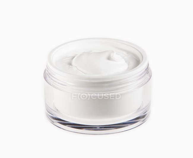 Close up of moisturizer in jar on white background — Stock Photo