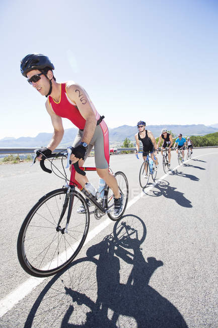 Cyclists in race on rural road — Stock Photo
