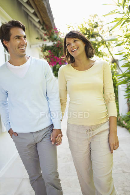 Couple walking together outdoors — Stock Photo
