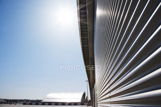 Close up of warehouse wall and blue sky — Stock Photo