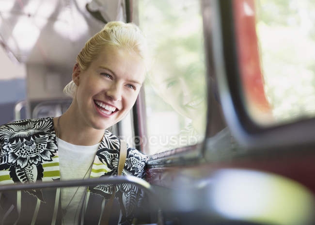 Enthusiastic woman riding bus — Stock Photo