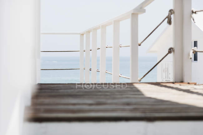 Wooden balcony interior overlooking ocean — Stock Photo