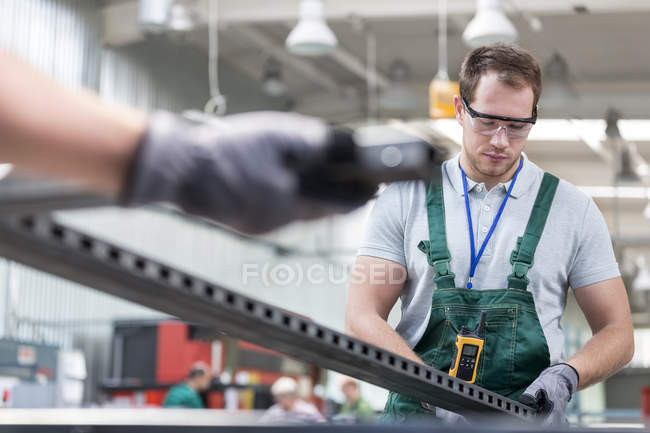 Worker in protective workwear in factory — Stock Photo
