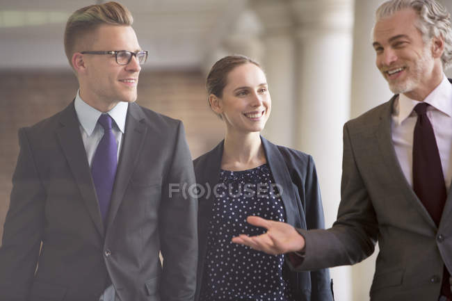 Business people talking outdoors — Stock Photo
