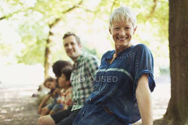 Portrait smiling multi-generation family in woods — Stock Photo