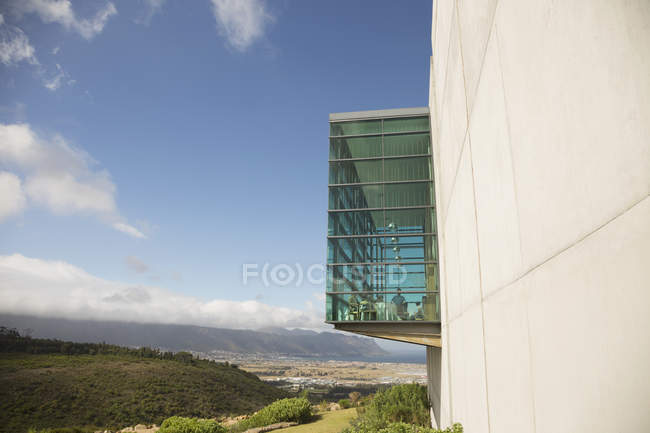 Glass bump out on building — Stock Photo