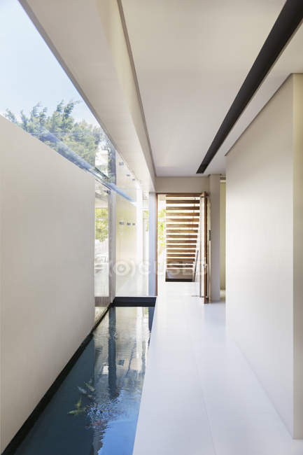 Pool and corridor of modern house interior — Stock Photo