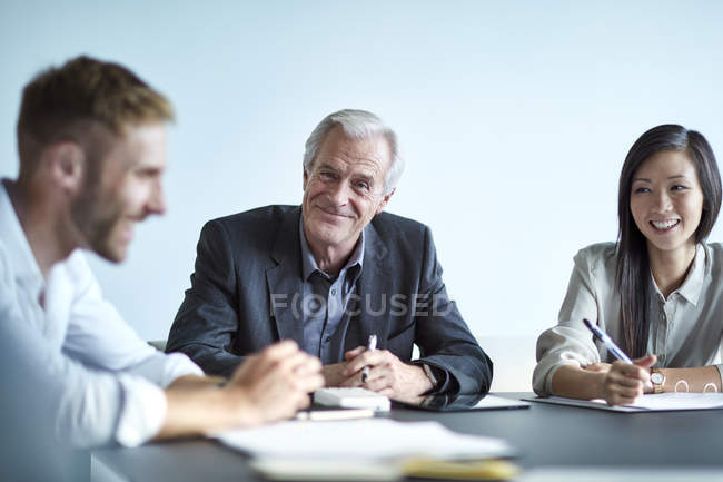 Portrait smiling senior businessman in meeting — Stock Photo