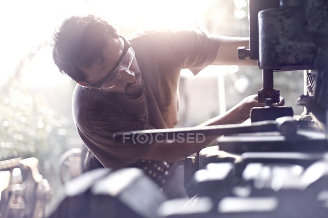 Blacksmith using vise grip in forge — Stock Photo