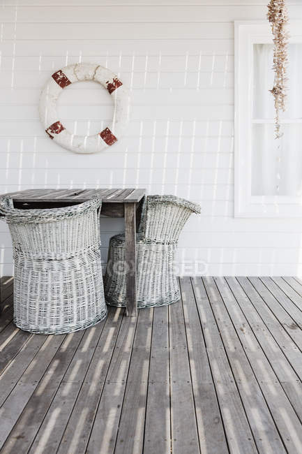Scenic view of wicker chairs on deck — Stock Photo