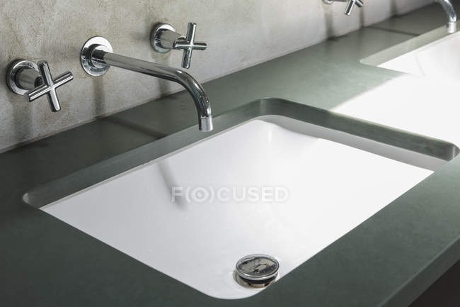 Closeup of faucet and sink in modern bathroom — Stock Photo