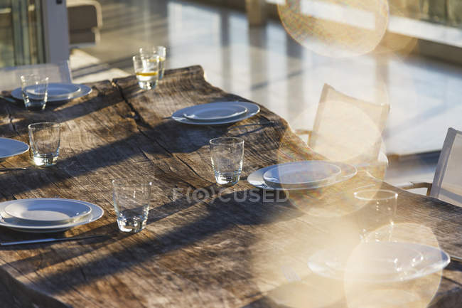 Set table on modern patio interior — Stock Photo