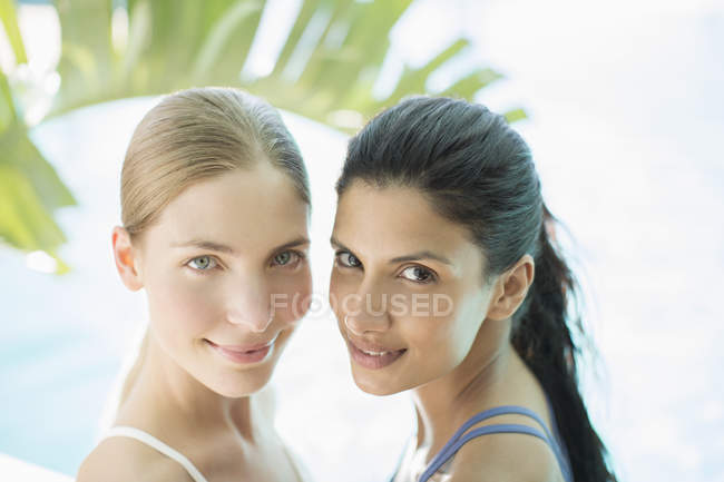 Portrait of smiling young attractive women — Stock Photo
