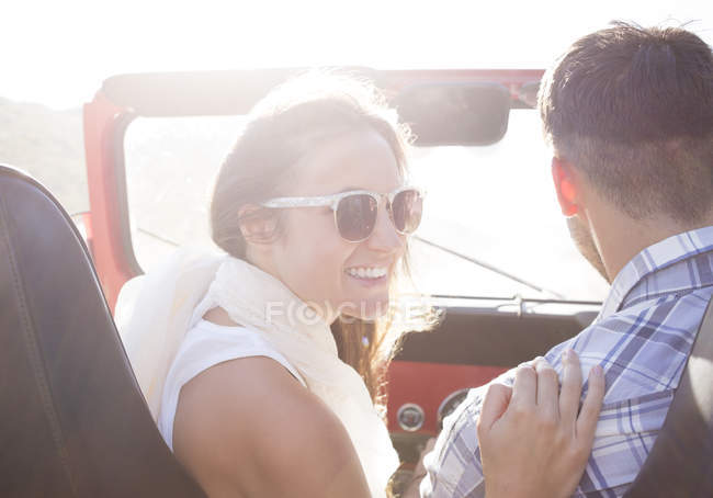 Couple in sport utility vehicle — Stock Photo