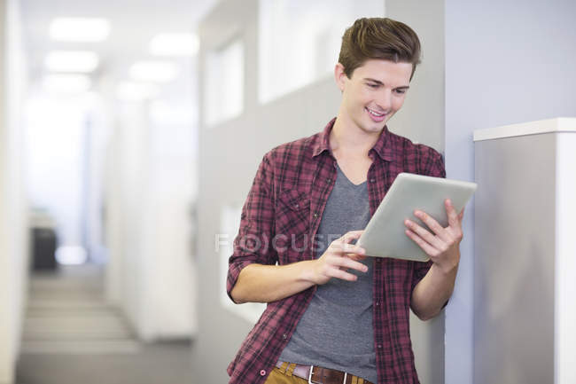 Businessman using digital tablet in office — Stock Photo