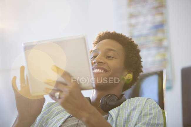 Businessman using digital tablet in modern office — Stock Photo