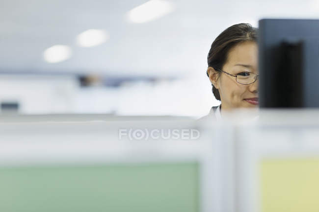 Businesswoman working at computer in office — Stock Photo