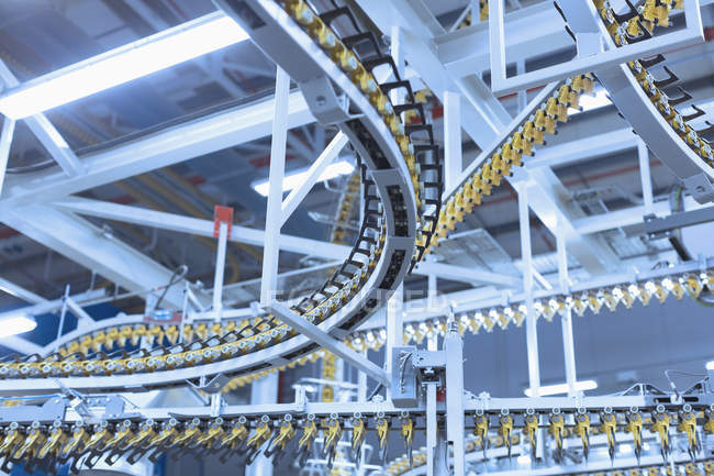 Winding printing press conveyor belts overhead — Stock Photo