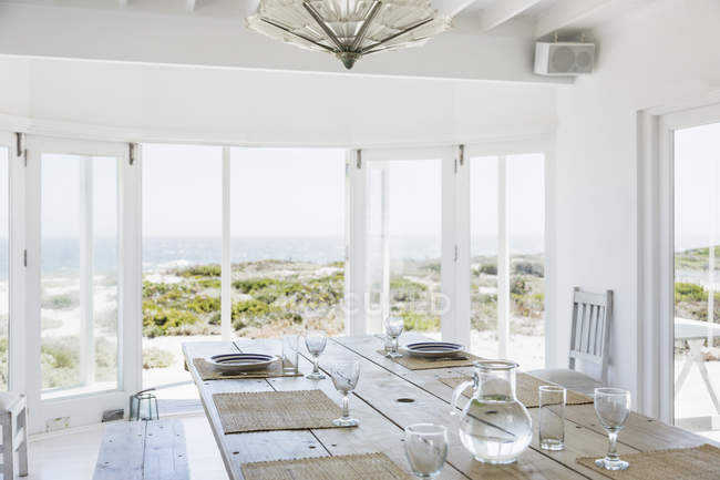 Dining room interior overlooking ocean — Stock Photo