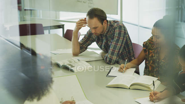 Focused college students studying in classroom — Stock Photo