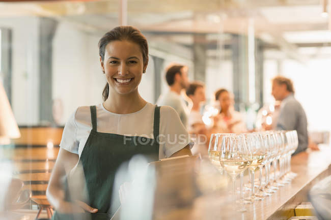 Portrait smiling winery tasting room worker — Stock Photo