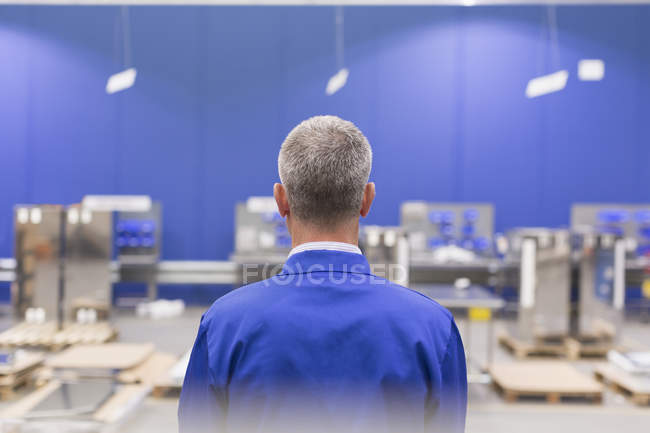 Supervisor watching steel plant — Stock Photo
