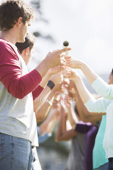 Team balancing pole with fingertips — Stock Photo