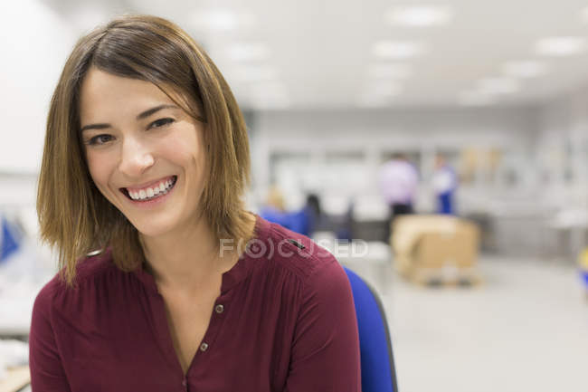 Portrait smiling manager in steel factory — Stock Photo