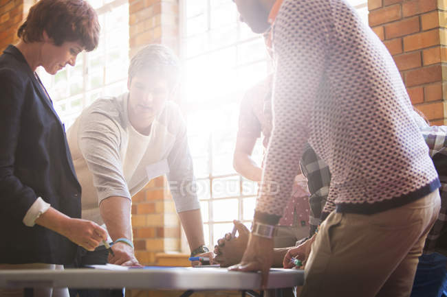 Creative business people meeting around table — Stock Photo