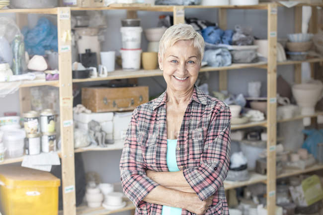 Portrait senior artist in pottery studio — Stock Photo