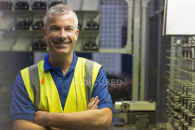 Portrait smiling worker in steel factory — Stock Photo