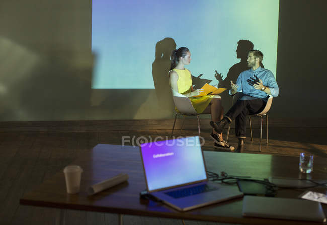 Business people preparing audio visual presentation in conference room — Stock Photo